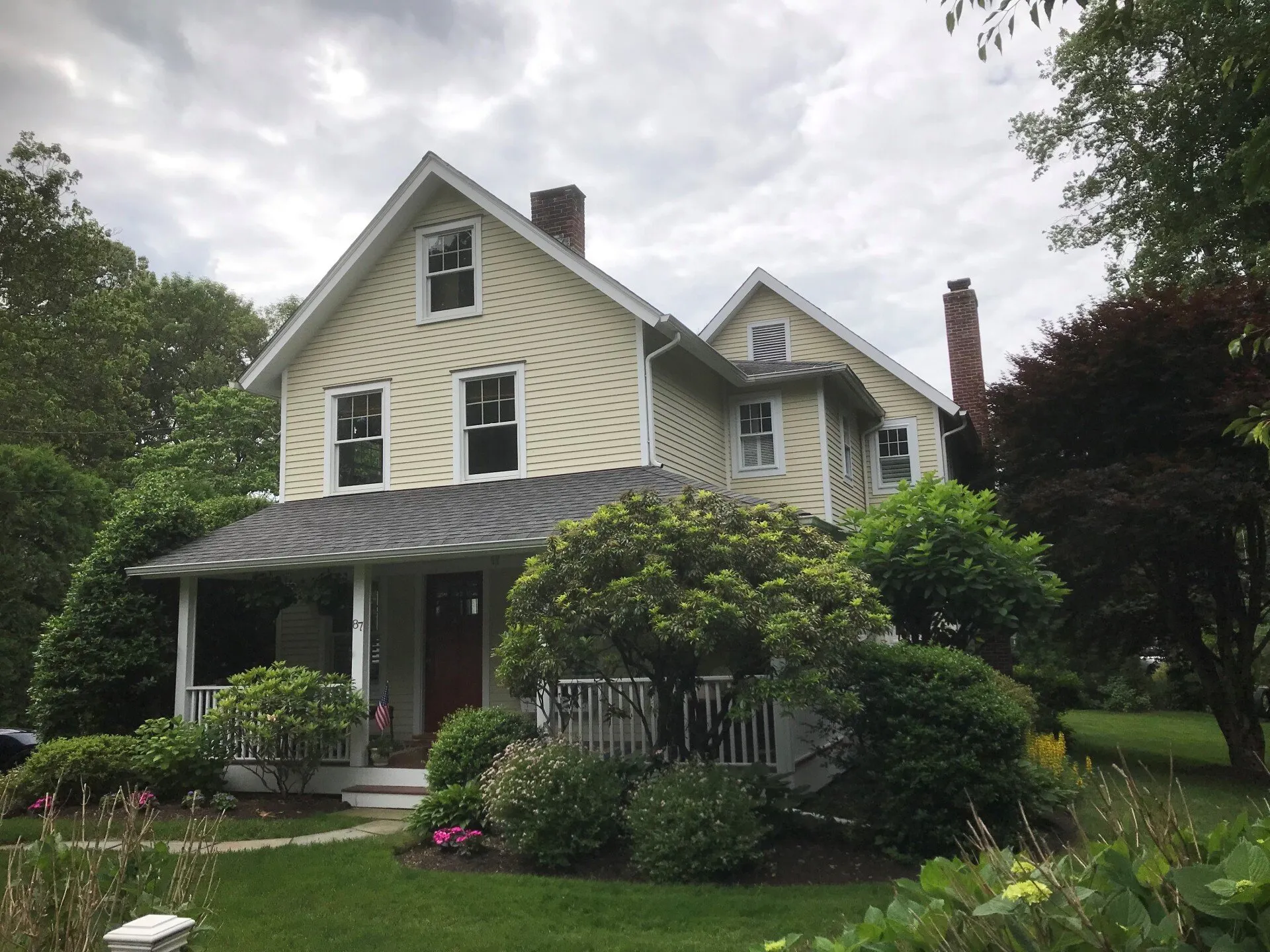 Two-story clapboard home with a covered front porch in Monmouth County, New Jersey