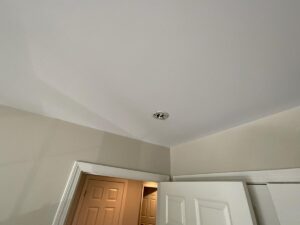 Ceiling mounting bracket in a hallway where a smoke alarm was removed and never replaced