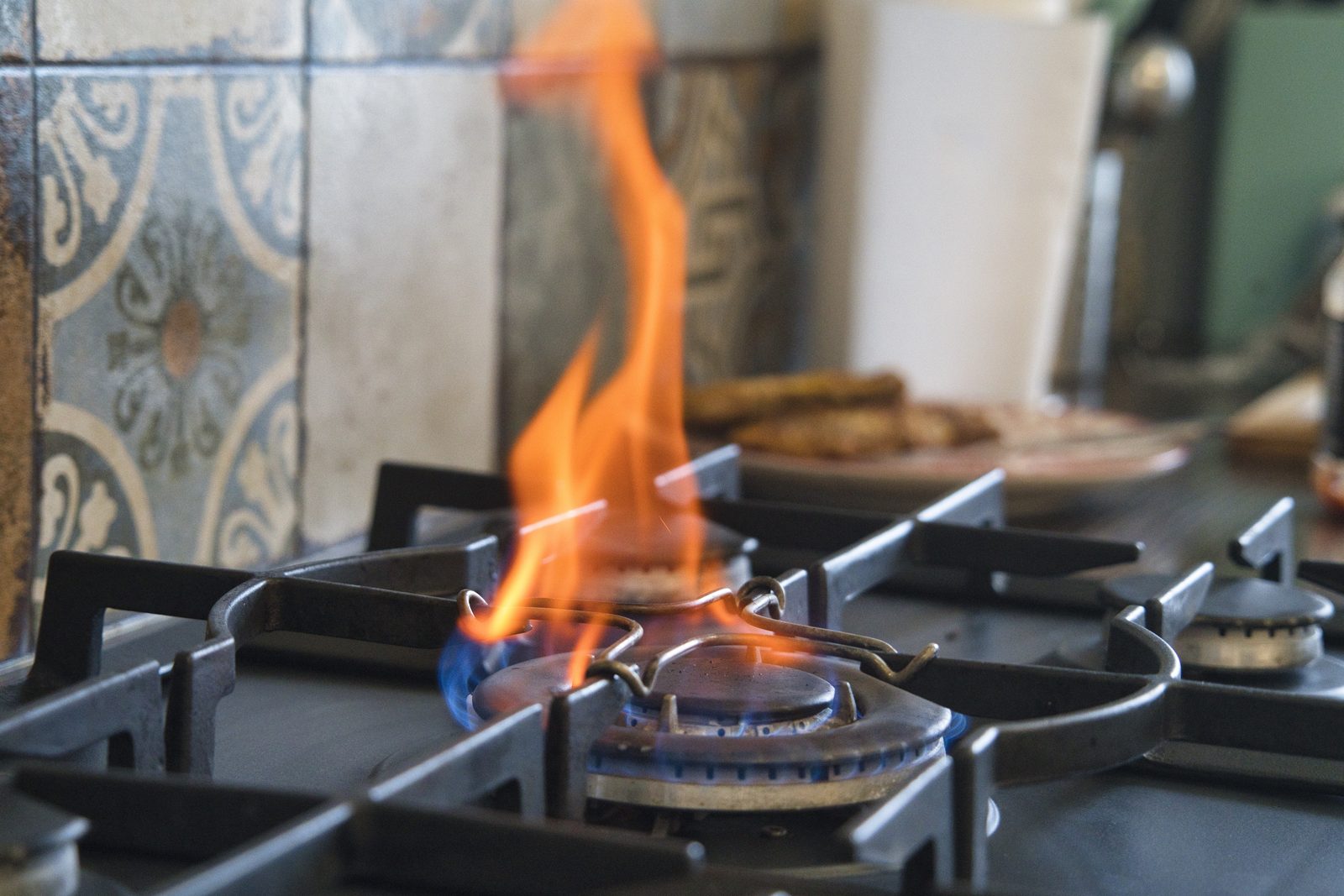 Burner flame igniting on a kitchen gas stove